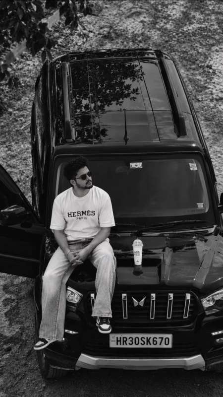 Scorpio photo editing prompt - Ultra-realistic black-and-white cinematic photo, vertical 9:16. A young